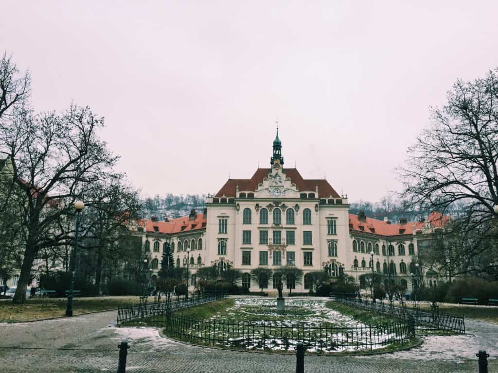When in Prague, explore the up-and-coming neighborhood of the Karlin District. Karlin District in Prague is easy to navigate with amazing coffee shops, a cat cafe, and astounding architecture including the prettiest elementary school you've ever seen! #prague #travel #czechrepublic #karlindistrict