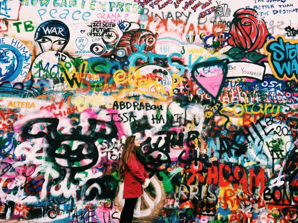 Observing the John Lennon wall in Prague.