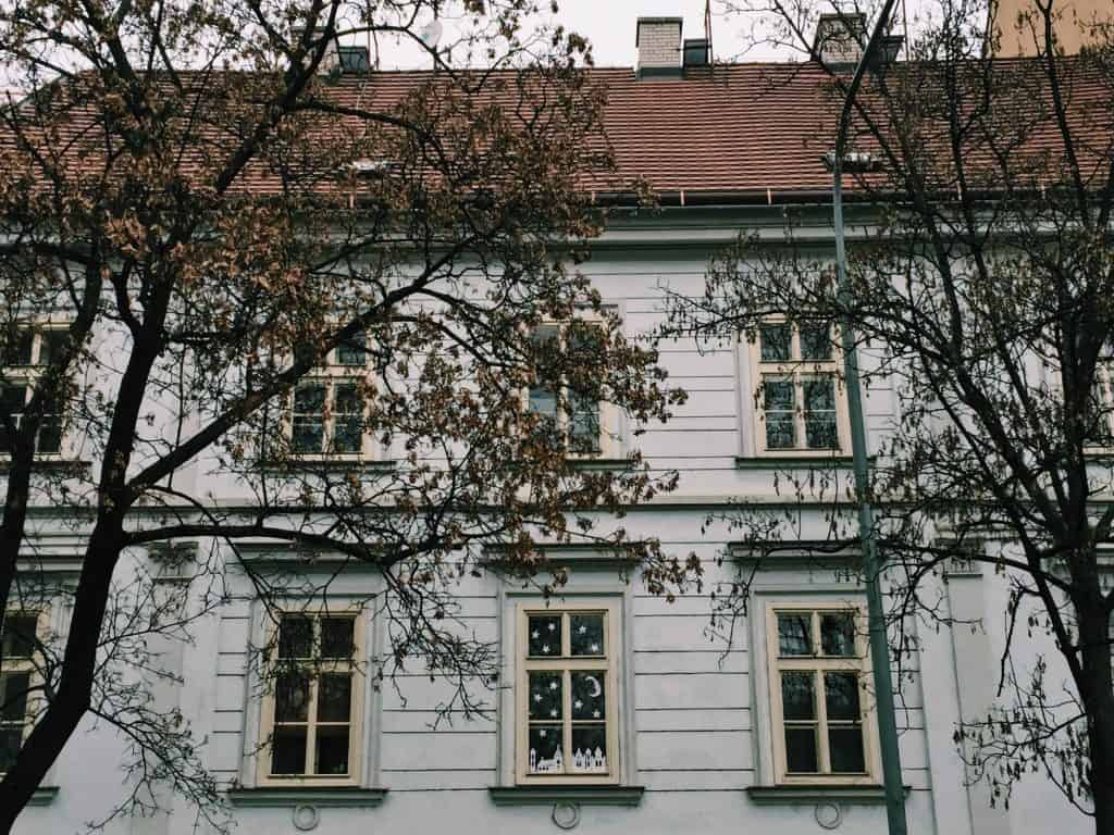 When in Prague, explore the up-and-coming neighborhood of the Karlin District. Karlin District in Prague is easy to navigate with amazing coffee shops, a cat cafe, and astounding architecture including the prettiest elementary school you've ever seen! #prague #travel #czechrepublic #karlindistrict