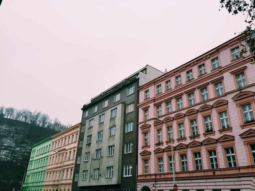 When in Prague, explore the up-and-coming neighborhood of the Karlin District. Karlin District in Prague is easy to navigate with amazing coffee shops, a cat cafe, and astounding architecture including the prettiest elementary school you've ever seen! #prague #travel #czechrepublic #karlindistrict