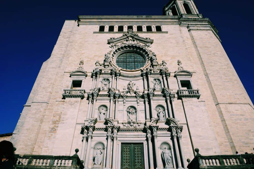 2. Explore Girona Cathedral (and Find the Witch!) Girona has a sprawling cathedral which was built across seven centuries, so just looking at the varying styles of architecture from outside is interesting (without paying the 7 € entry fee). Make sure to spot the witch! Legend has it that one of the many gargoyles which spout rain water from the Cathedral's top ledge is a witch who used to throw stones at the Cathedral. She was turned into a Gargoyle as punishment so no more curses would come from her mouth. She's really there - see if you can find her!