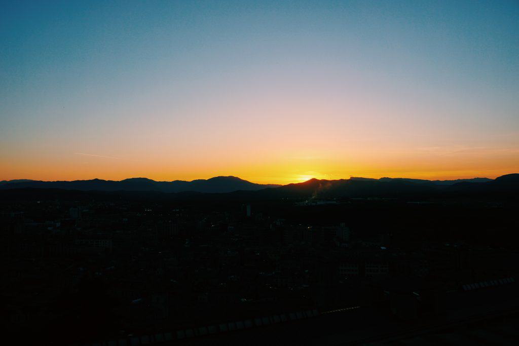 4. Walk the Medieval Walls / Passeig de la Muralla (and Find the Toilet!) Girona was once a walled city, and now you can walk along the top of the remains of the medieval walls! The walls also host the very best view of the city, including the mountains beyond. We strolled along at sunset which was gorgeous. If you're a weirdo like us - try to find the "toilet" along the far wall. It looks like a corner bench, but has a circular hole in it that you can see all the way down (hundreds of feet...) to the ground. Apparently this served as a 9th century toilet for the wall's guards?!