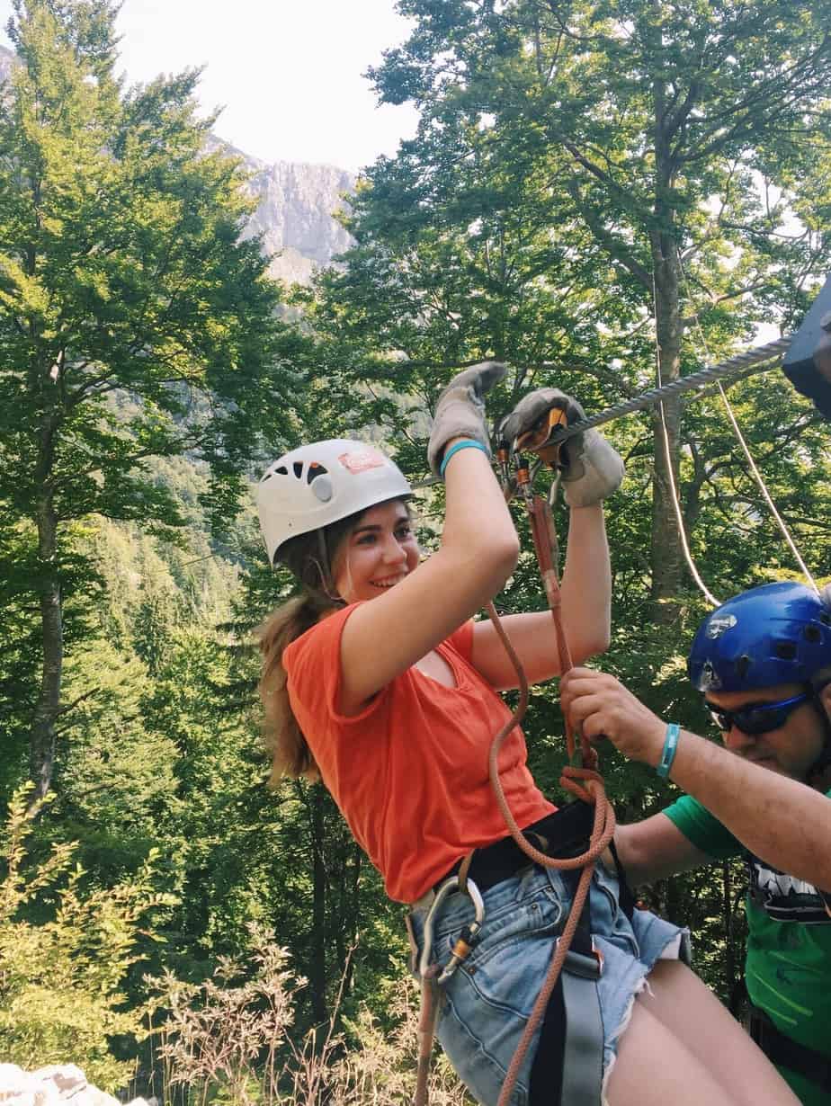 Me getting harnessed in by our guide for my first zipline. You can't go to Slovenia without ziplining with Aktivni Planet in Europe's biggest zipline park. Ziplining in Slovenia is unlike anything else.