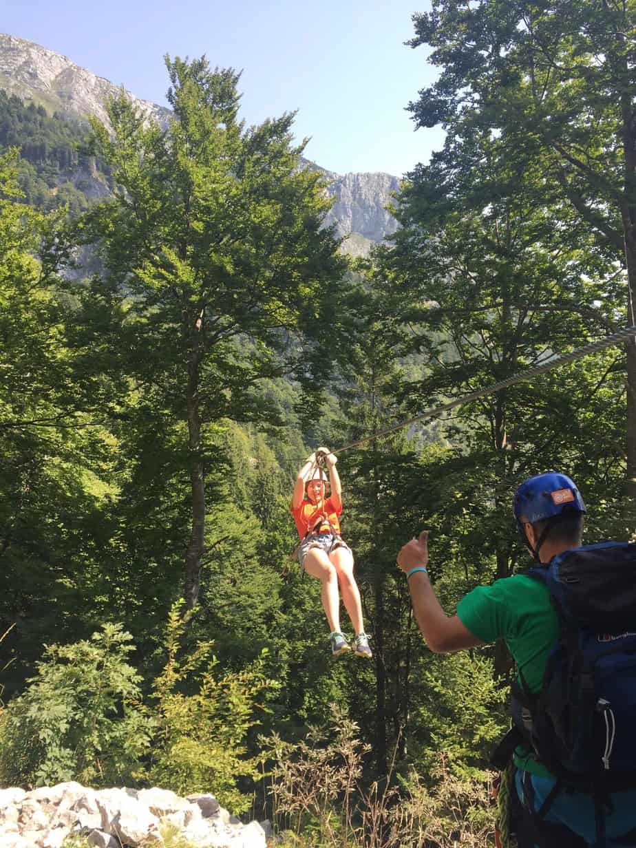 Me returning to land after ziplining, getting the thumbs up from our guide. You can't go to Slovenia without ziplining with Aktivni Planet in Europe's biggest zipline park. Ziplining in Slovenia is unlike anything else.