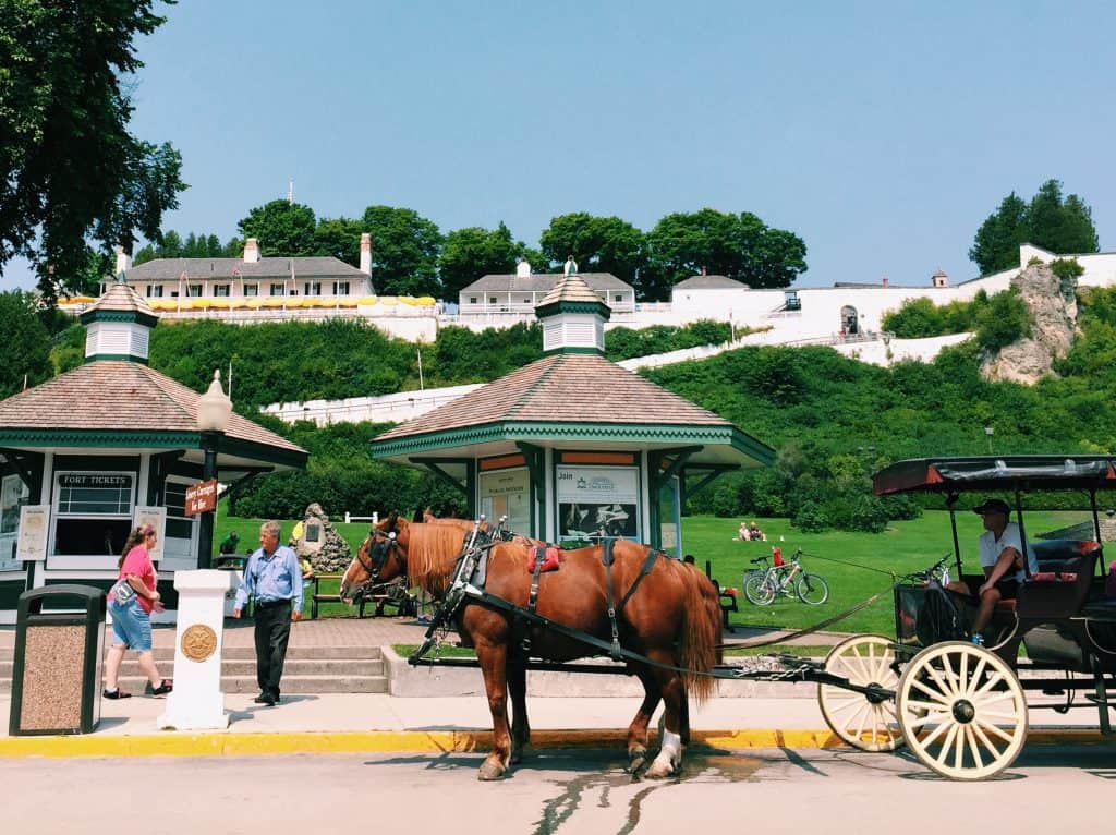 Read this guide for everything you need to know for your vist to the Grand Hotel Mackinac Island - one of the best hotels in the world! #grandhotel #grandhotelmackinac #mackinac #mackinacisland #michigan #puremichigan #travel