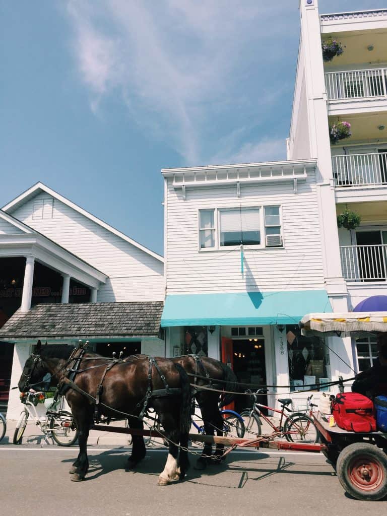 Read this guide for everything you need to know for your vist to the Grand Hotel Mackinac Island - one of the best hotels in the world! #grandhotel #grandhotelmackinac #mackinac #mackinacisland #michigan #puremichigan #travel