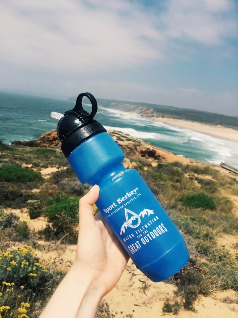 Every travel needs to invest in a travel filter water bottle. Here is your guide to travel filter water bottles, why travelers need one, and the best brand that filters out 99.9% of contaminants! #travel #travelwaterbottle #berkey #berkeyfilters #travelgear #travelfilterwaterbottle