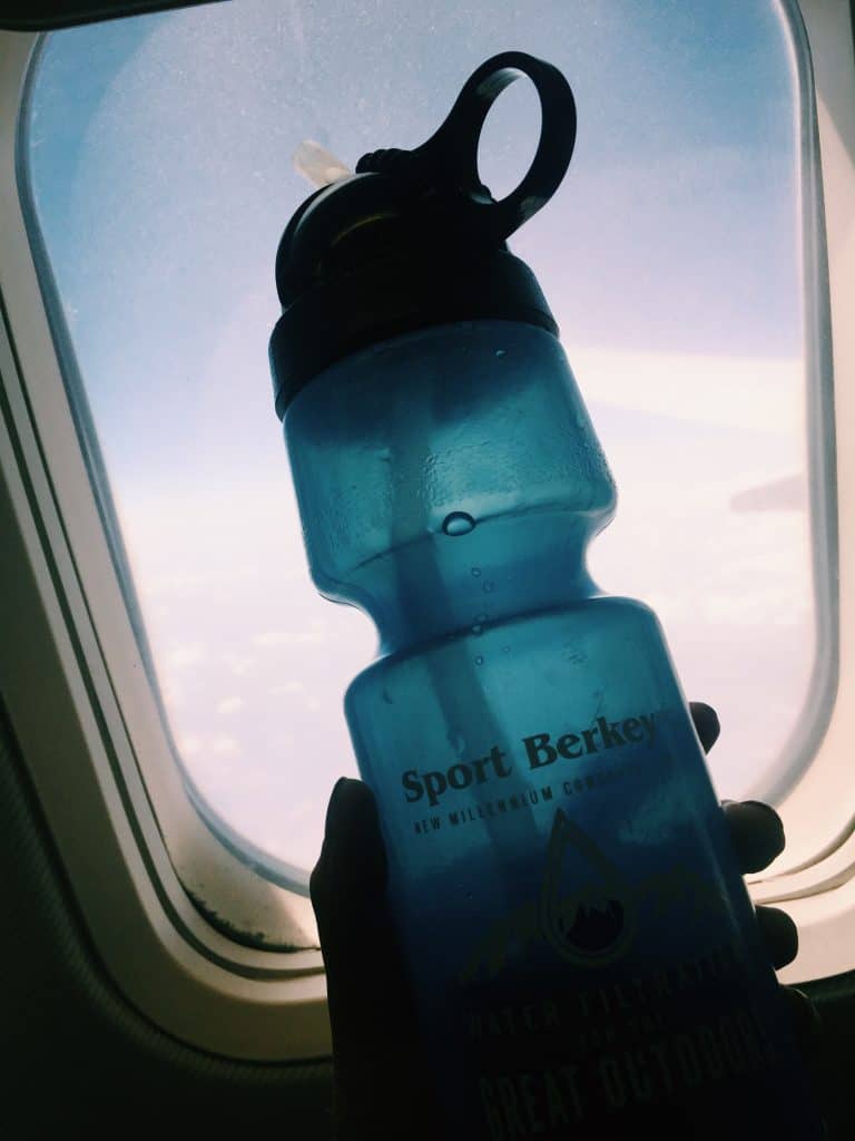 Every travel needs to invest in a travel filter water bottle. Here is your guide to travel filter water bottles, why travelers need one, and the best brand that filters out 99.9% of contaminants! #travel #travelwaterbottle #berkey #berkeyfilters #travelgear #travelfilterwaterbottle