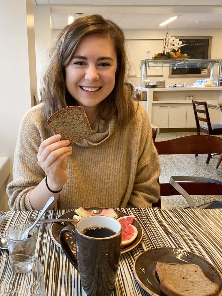 Eating gluten free bread at Le Monastere Des Augustines in Quebec City. Breakfast is served in silence.