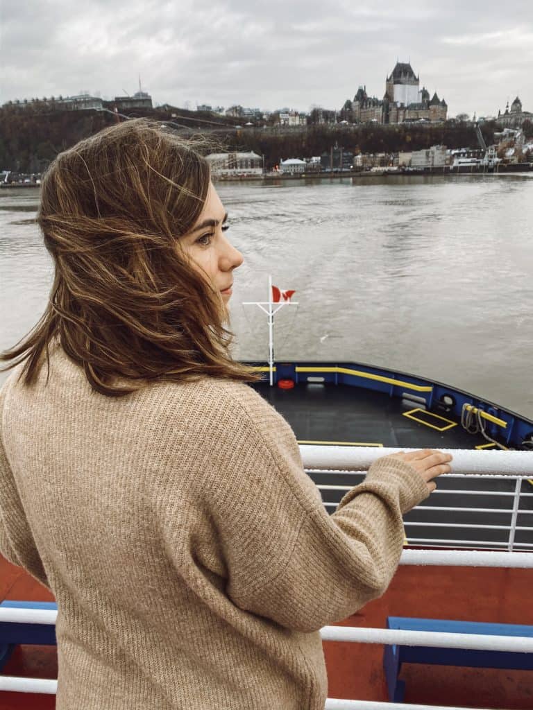 Me on the Levis Ferry pondering which is the best out of my things to do in quebec city in winter.