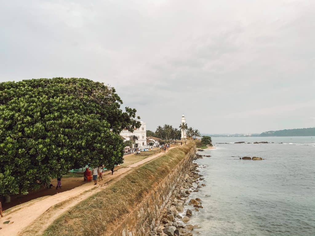 A complete guide to places to visit in Galle, Sri Lanka. Includes 13 amazing things to do in Galle from stilt fishing, bike tours, restaurants, and more. #gallesrilanka #thingstodoingalle #thingstodoingallesrilanka