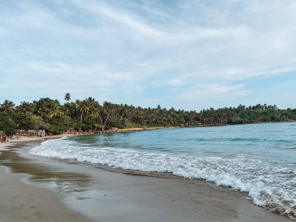 A complete guide to Hiriketiya Beach Sri Lanka, the south coast surfing bay. But Hiriketiya is more than surfing! Here are 15 things to do in Hiriketiya. #hiriketiyabeach #hiriketiyabeachsrilanka #thingstodoinhiriketiya #srilankasouthcoast