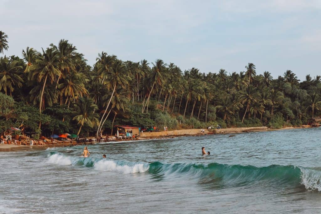 A complete guide to Hiriketiya Beach Sri Lanka, the south coast surfing bay. But Hiriketiya is more than surfing! Here are 15 things to do in Hiriketiya. #hiriketiyabeach #hiriketiyabeachsrilanka #thingstodoinhiriketiya #srilankasouthcoast