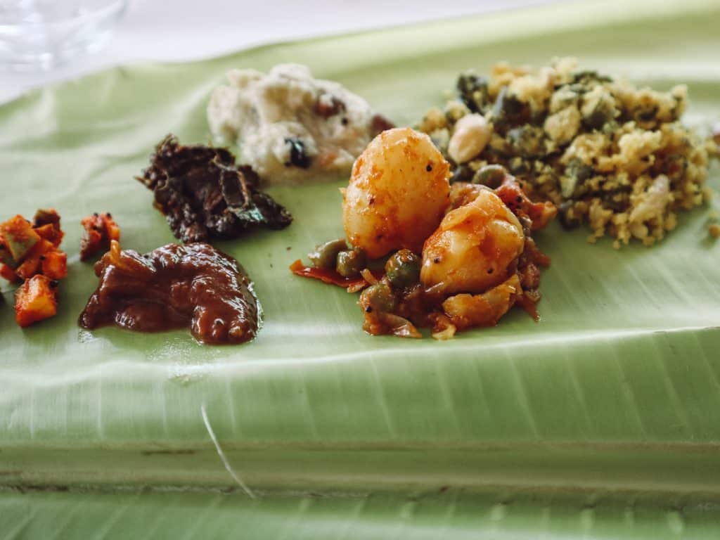Examples of gluten free india dishes traditional to the south, served on a banana leaf.
