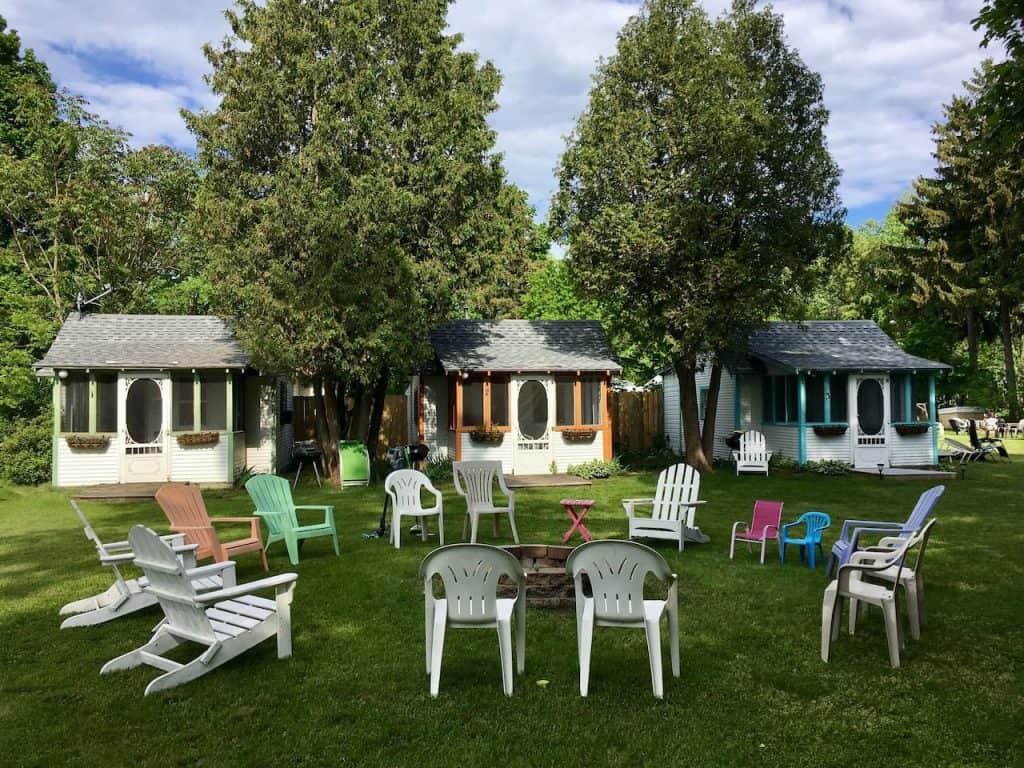 cottages with circled of adirondack chairs in Michigan