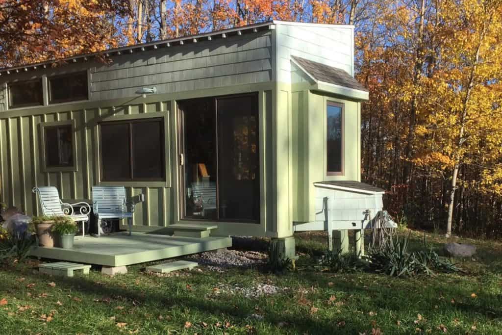 A pale green tiny house in Leelanau Michigan.