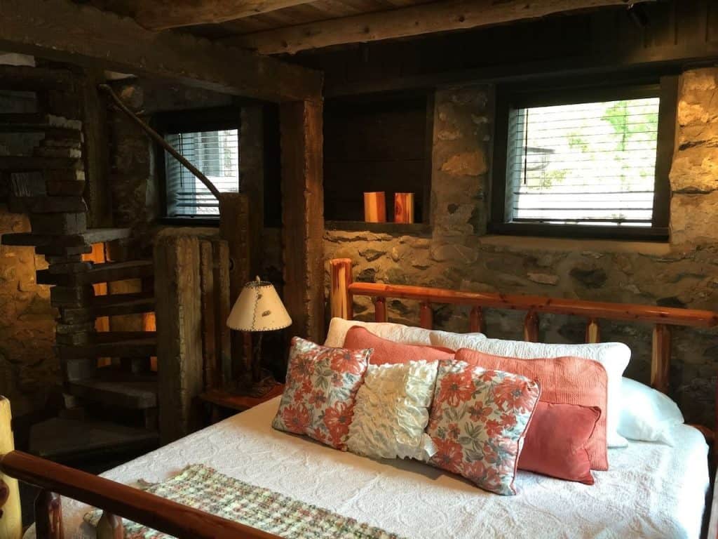 The quaint master bedroom at The Chalet, one of the Charlevoix hobbit homes