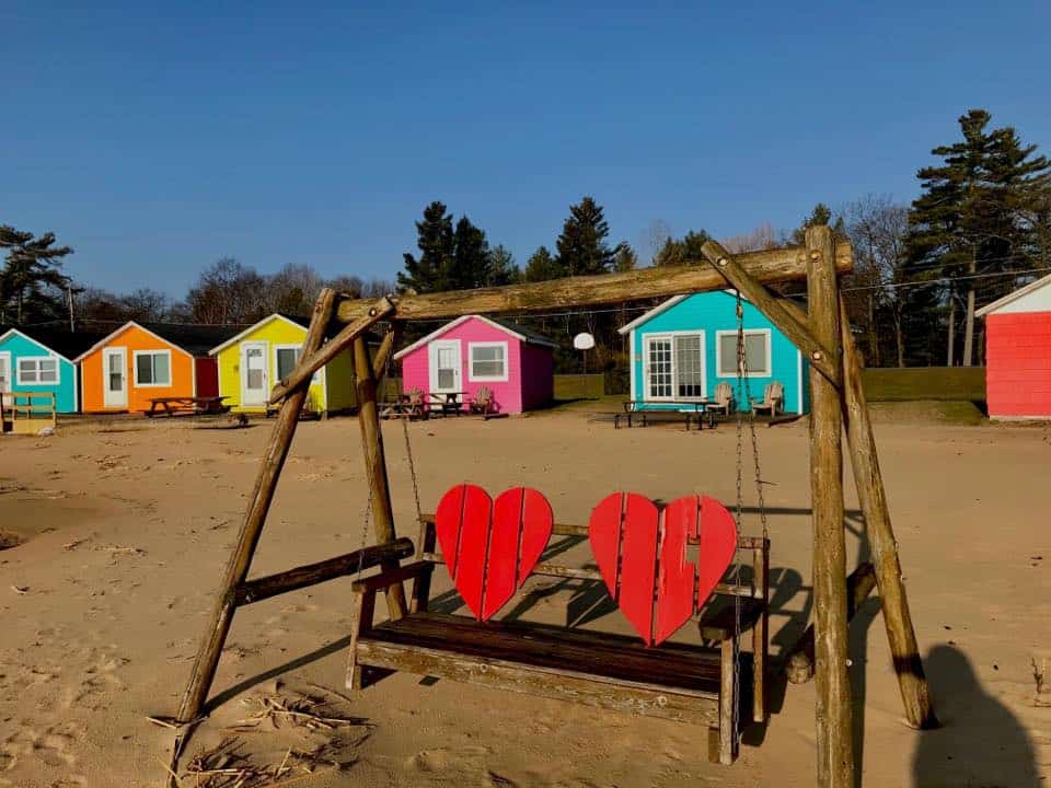 Colorful beach huts along Lake Huron in Michigan at Mai Tiki Resort