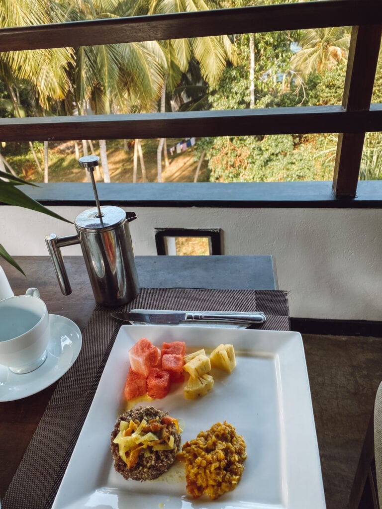 gluten free sri lankan breakfast of puttu and fruit and coffee