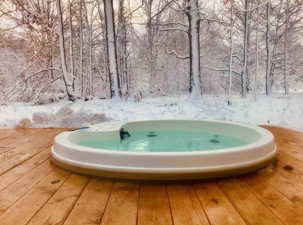 Romantic jacuzzi overlooking the snowy forest,