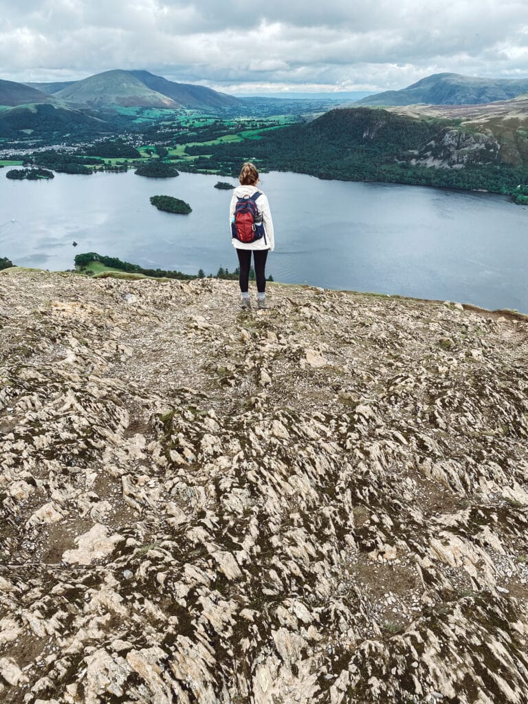 Sarah standing on rocks at Catbells 