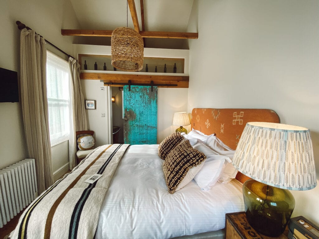 Artist residence hotel room with view of bed and bathroom door