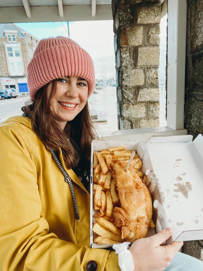 Sarah holding tray of gluten free fish and chips