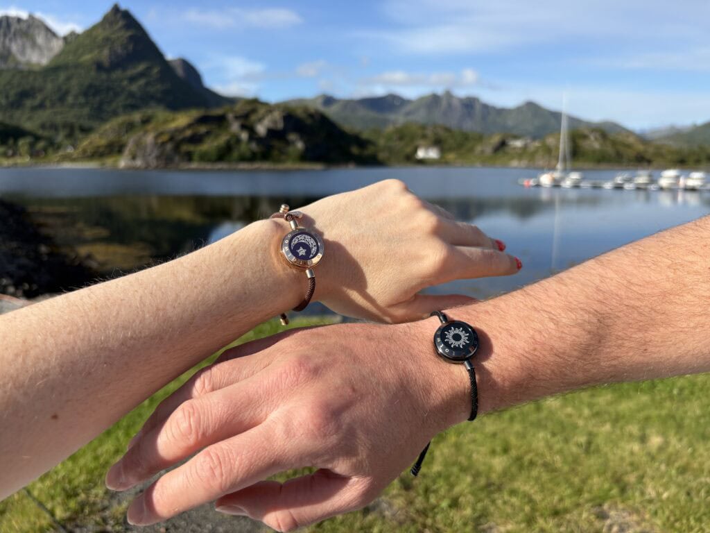 Two arms in front of mountainous background, wearing TOTWOO long distance relationship bracelets