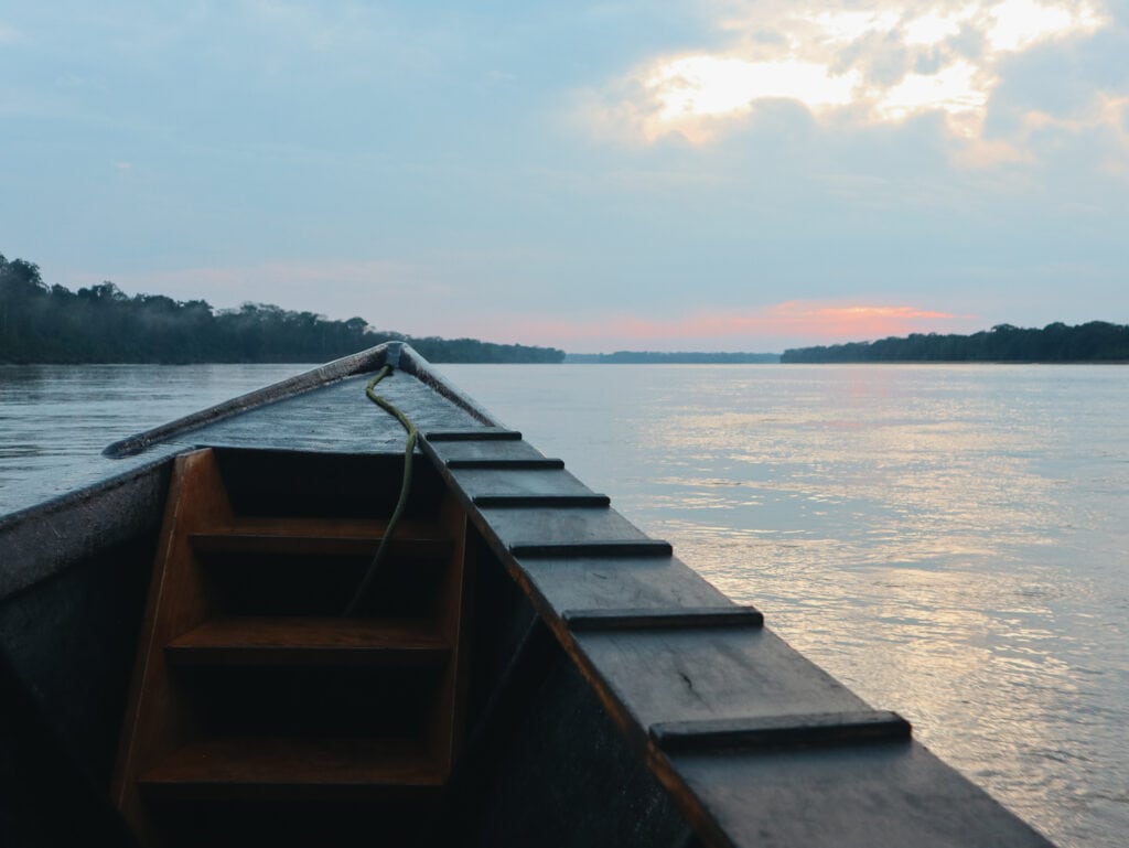 Sunrise boat journey along the Madre de Dios river in the Peruvian Amazon