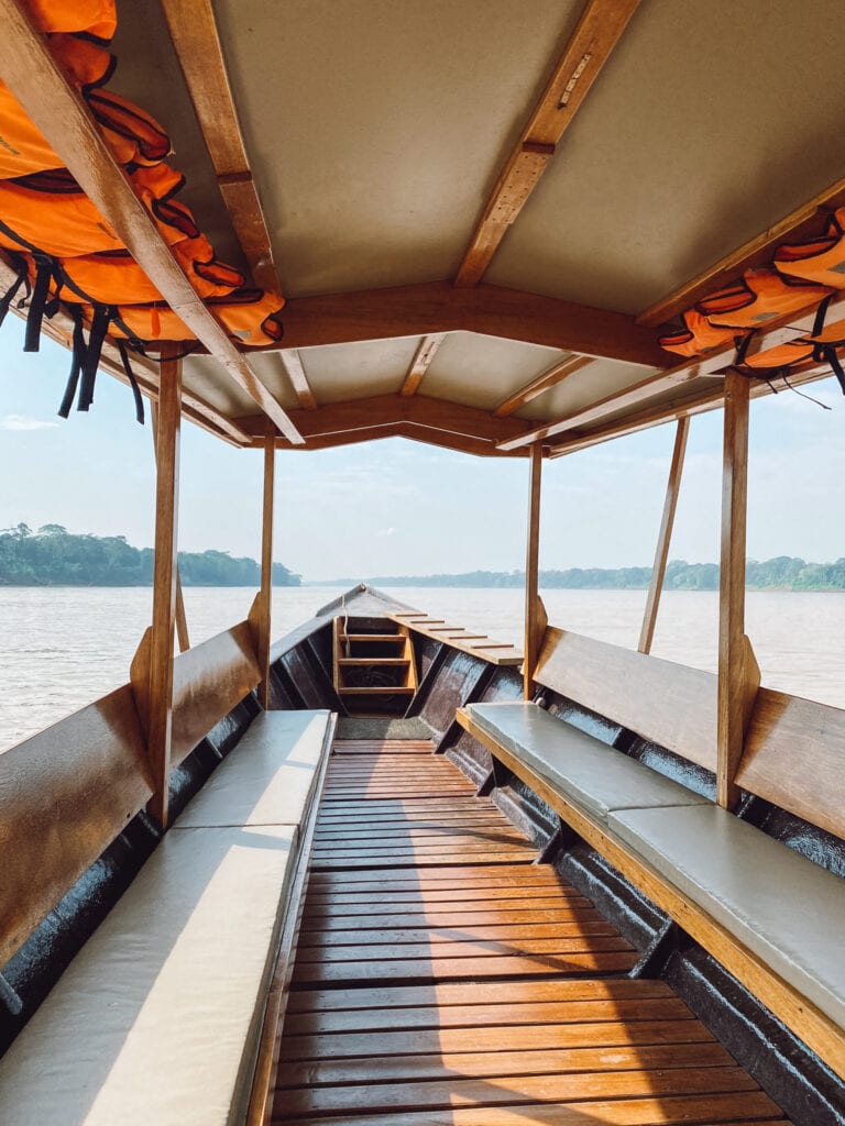 A boat along the Madre de Dios rive en route to Inkaterra Reserva Amazonica