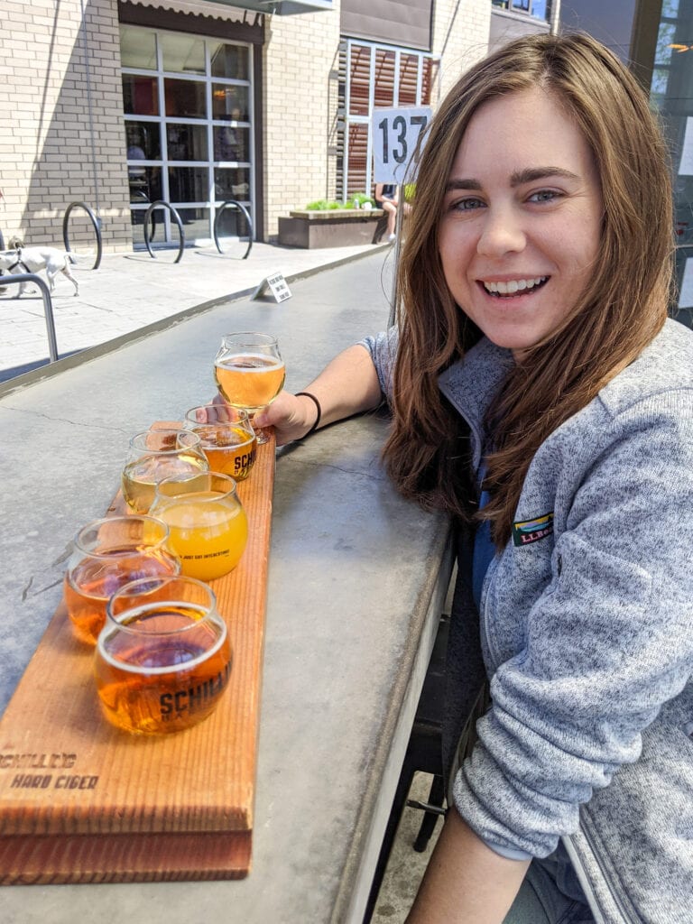 sarah with a flight of gluten free ciders