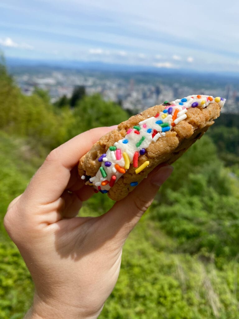 gluten free cookie sandwich with views over the city of portland oregon from pittock mansion