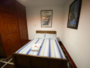 Simple bedroom at Hostal La Comedia in Jardin Colombia