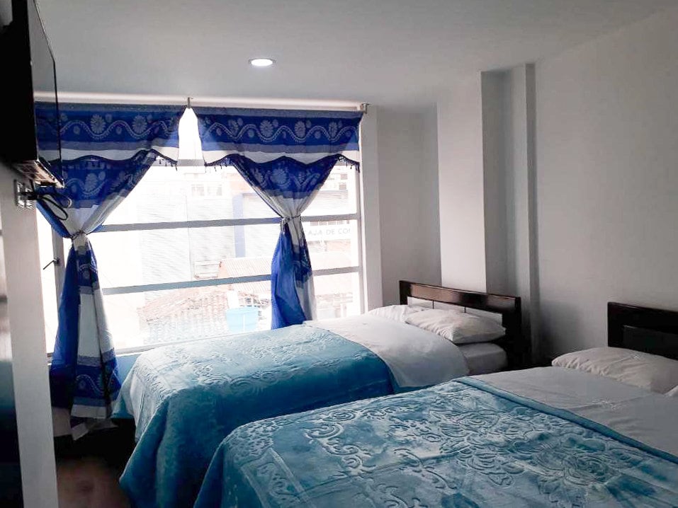 Two blue beds in a hotel in Ipiales Colombia