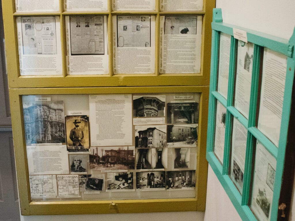 history plaques on the wall explaining the history of a hostel in portland