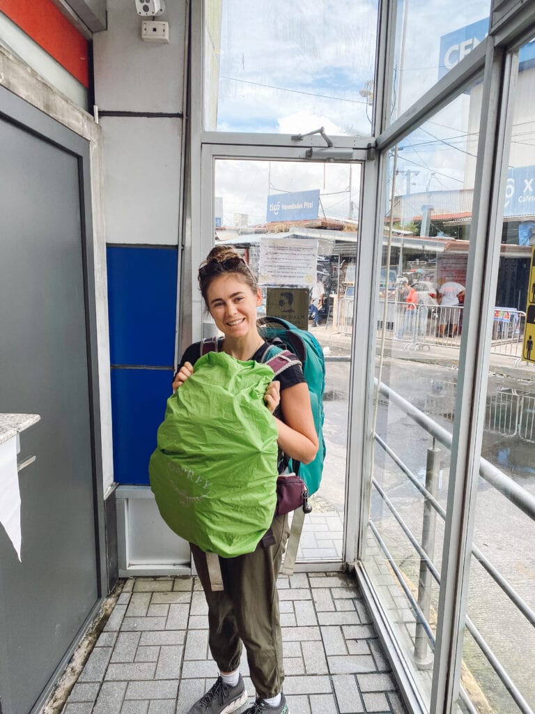 sarah standing in the panama immigration office at the panama costa rica border