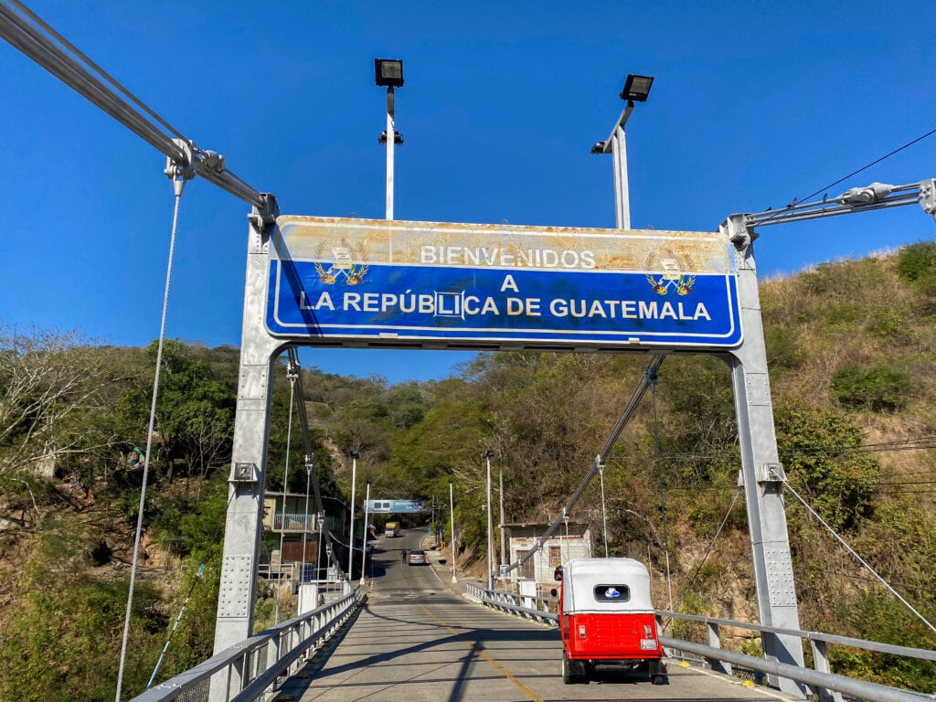welcome to guatemala sign at the las chinimas border with el salvador