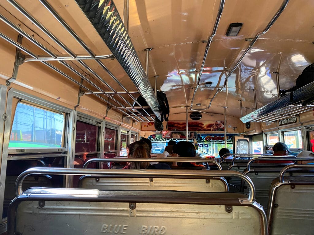 Metal seats in chicken bus.