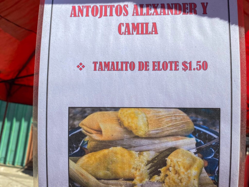 A sign advertising tamalito de elote.