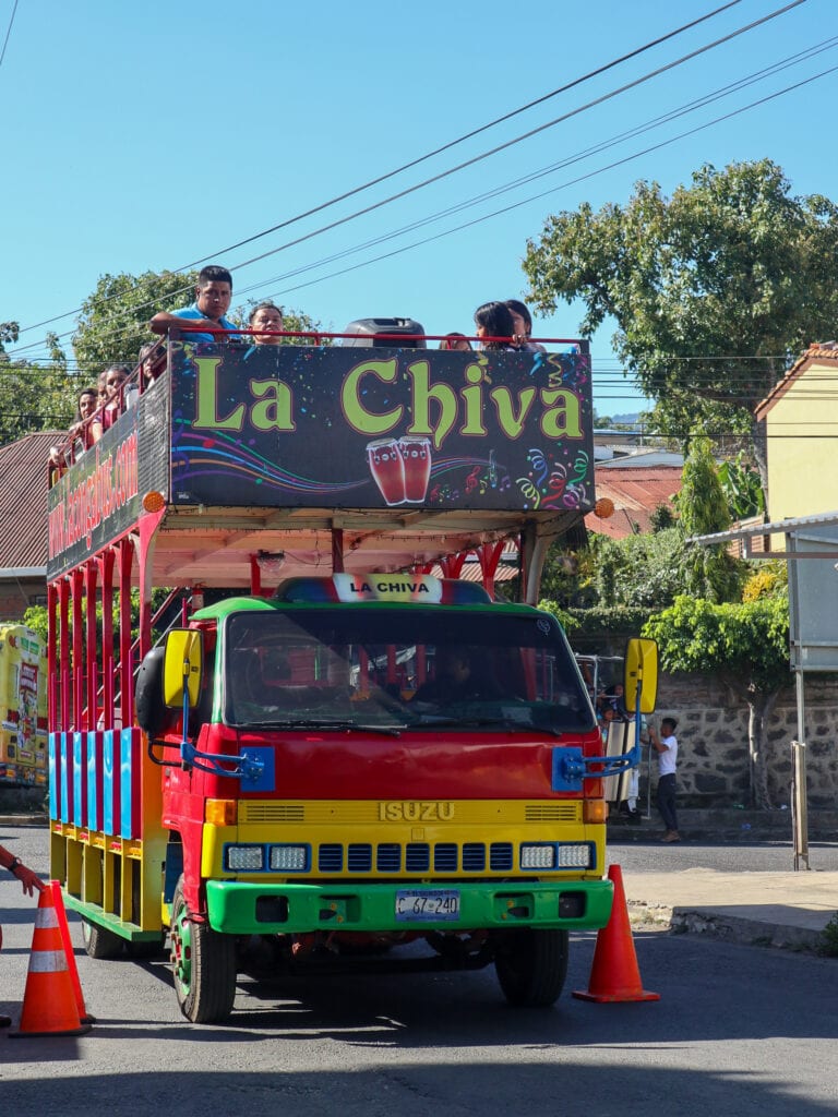 A red yellow and green chiva bus in El Salvador