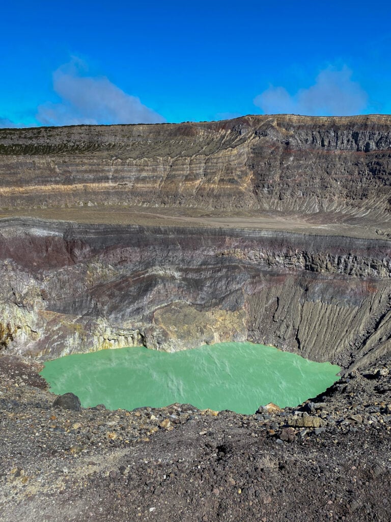 The crater lake in Santa Ana Volcano in El Salvador with blue skies in the background.
