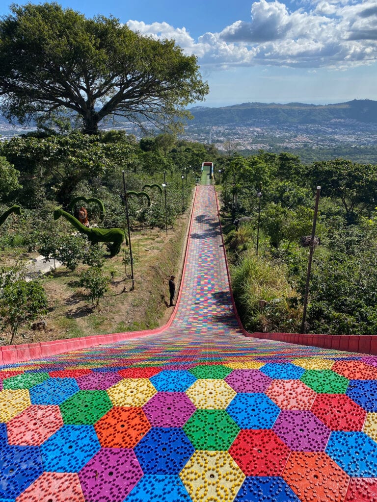 Rainbow slide with view of San Salvador in distance.