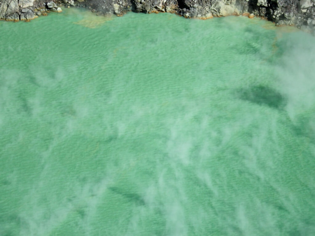 Very close view of the steam cloud over the blue green lake at Santa Ana Volcano in El Salvador.