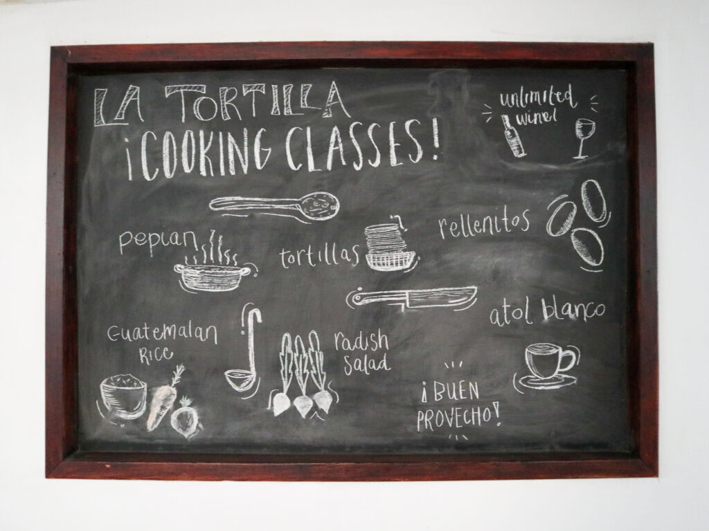 A blackboard with chalk drawings of Guatemalan food.