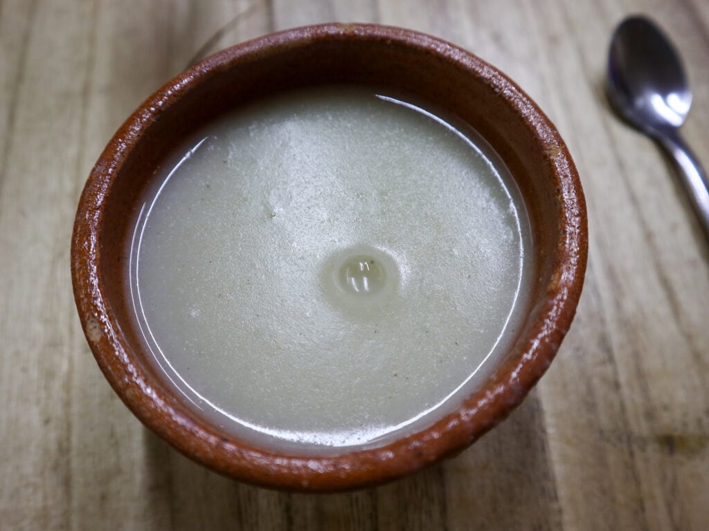 A clay cup of atol blanco, a traditional Guatemalan drink.