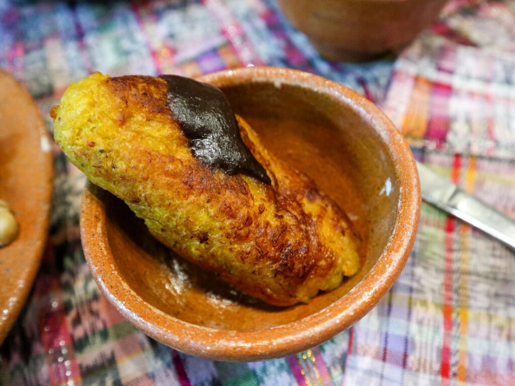 Clay bowl with a rellenito in it.