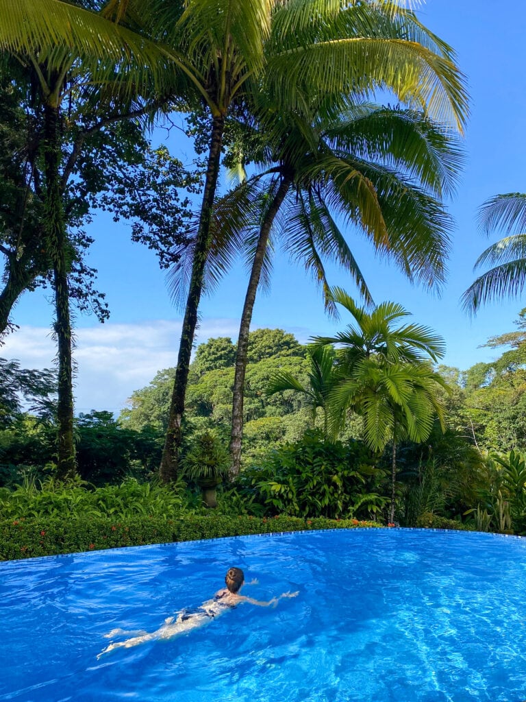 sarah swimming in an infinity pool