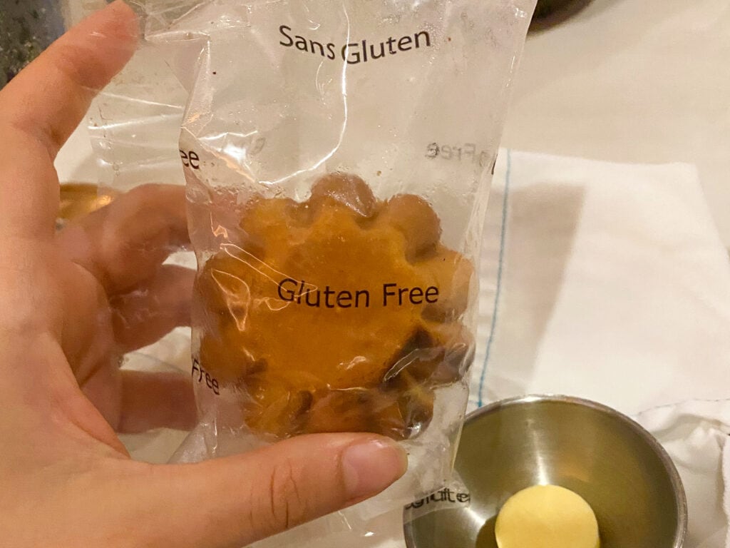 a packaged gluten free roll that says gluten free on the plastic wrap.