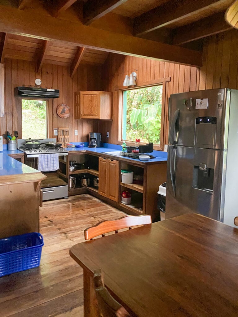 a kitchen in a wooden cabin