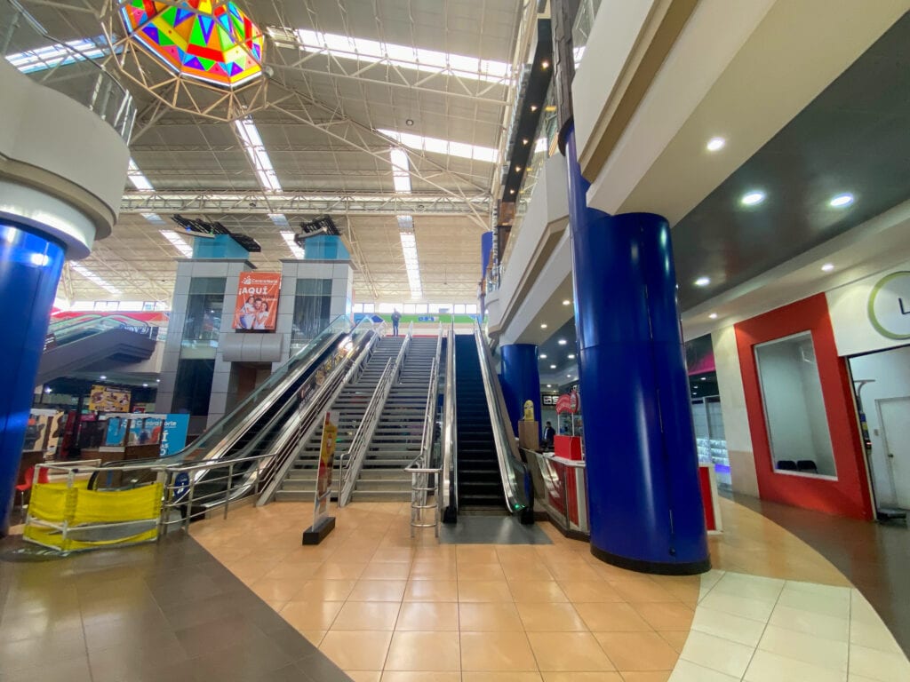 A large set of stairs inside a bus terminal.